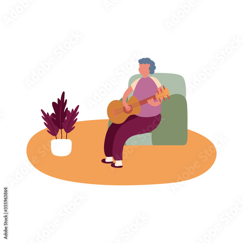 eldery man playing guitar in home activity free form style