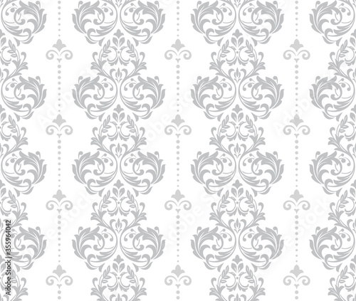 Wallpaper in the style of Baroque. Seamless vector background. White and grey floral ornament. Graphic pattern for fabric, wallpaper, packaging. Ornate Damask flower ornament.