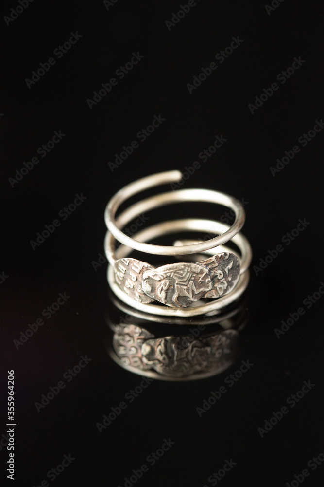 On a black background a silver ring
On a black background a silver ring