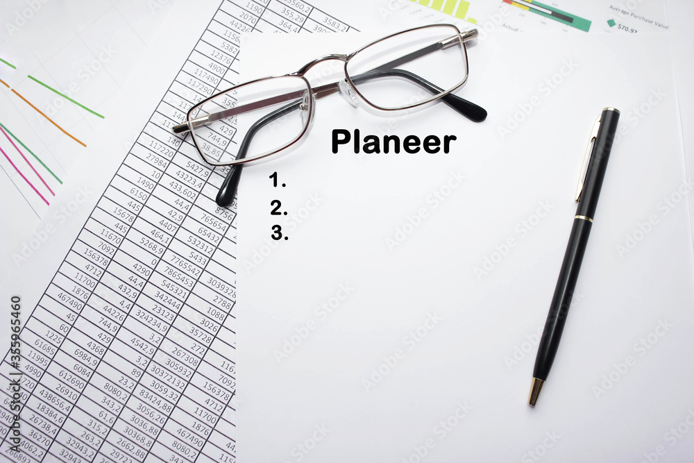Accounting plan on a sheet of white paper with pen and glasses Accounting plan on a sheet of white paper with pen and glasses