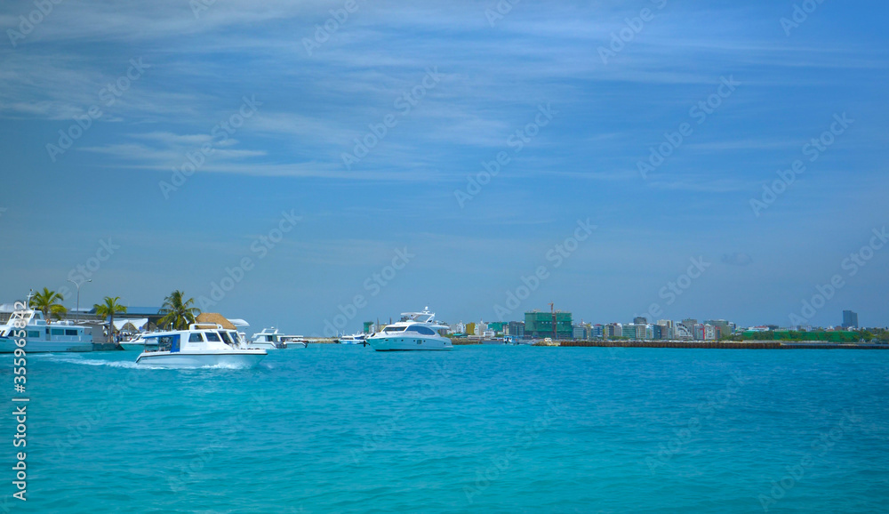 Water taxi takes tourists from one scenic island in Maldives to another