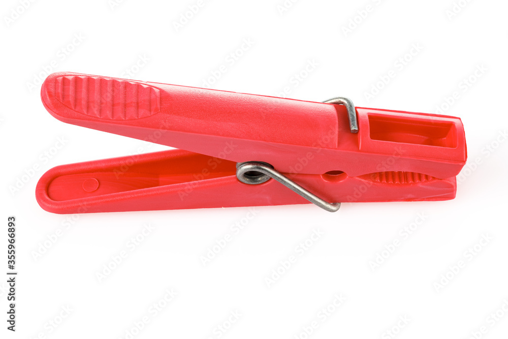 Red plastic clothespins isolated on white background. Plastic clips. Close-up. Full depth of field. Red plastic clothespins isolated on white background. Plastic clips. Close-up. Full depth of field.