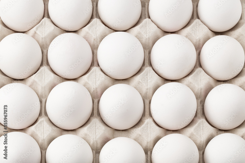 Chicken eggs in carton box isolated on white background. Top view Chicken eggs in carton box isolated on white background. Top view