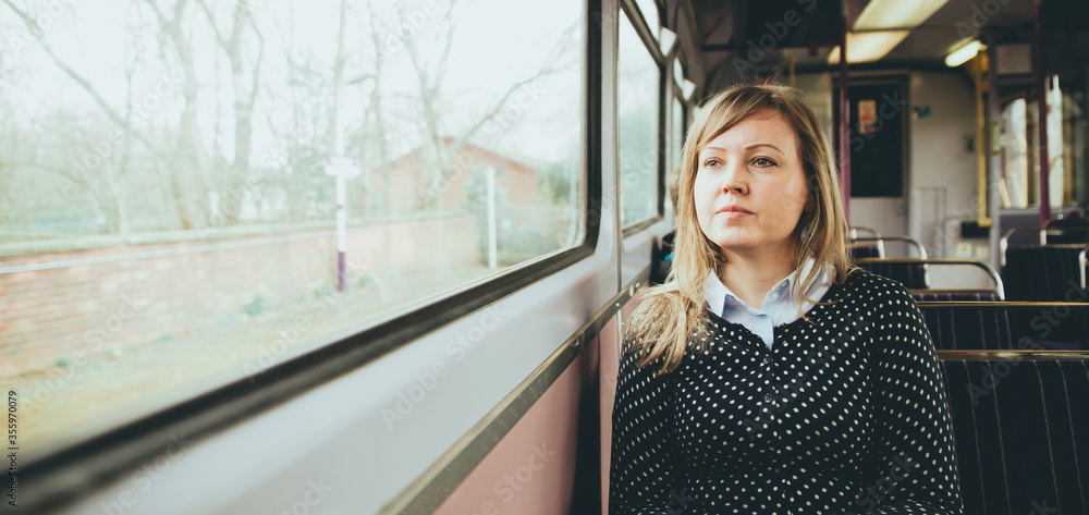 young woman on the train. Young woman on a train looking out the window