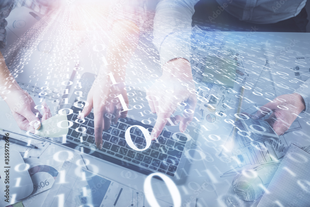 Double exposure of man and woman working together and data theme hologram drawing. Computer background. Top View. Double exposure of man and woman working together and data theme hologram drawing. Computer background. Top View.