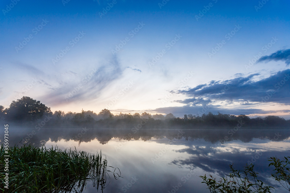 Obraz premium Quiet river in the fog at night. A place for night fishing or hunting