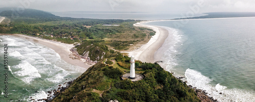 Lighthouse of Farol das Conchas,  built in 1872, Ilha do Mel, Paranagua, Parana State, Brazil, Panoramic view. July 2018. photo