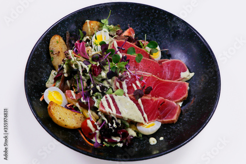 classic nicoise salad with seared tuna and crunchy vegetables