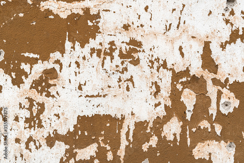 Old house wall falling apart texture background orange brown yellow white grunge space for text