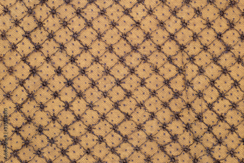 Vintage Lace circa 1800s that is brown on golden yellow background with repeating pattern background.  It is horizontal but can be vertical.  It converts well to black and white and sepia.