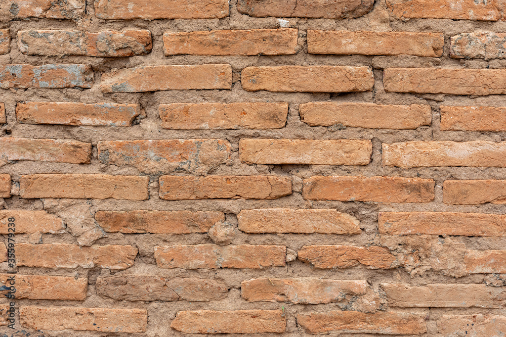 Obraz premium Exposed brick wall or wall, with apparent mortar. Texture for backgrounds