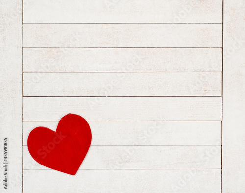 Bild auf Leinwand A Red Valentines Day Heart on Rustic White Wood Boards Background with room or space for copy, text or your words