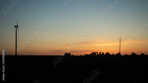 Wind generator at sunset on a warm day