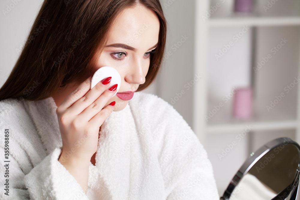 Beautiful girl with healthy skin makes makeup Beautiful girl with healthy skin makes makeup