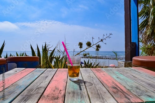 Nice alcohol drink at the beach of Zahora on the beach bar of Sahorami, Andalusia with sea view photo