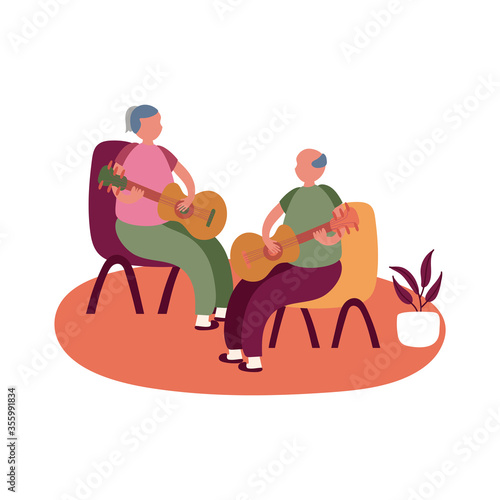 eldery couple playing guitars in home activity free form style