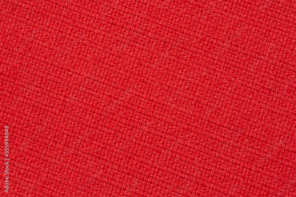 Fototapeta premium red wool fabric texture, diagonally arranged upholstery cloth background