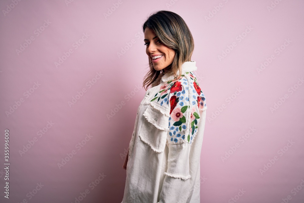 Young beautiful woman wearing fashion urban clothes, model wearing casual street style standing over pink background Young beautiful woman wearing fashion urban clothes, model wearing casual street style standing over pink background
