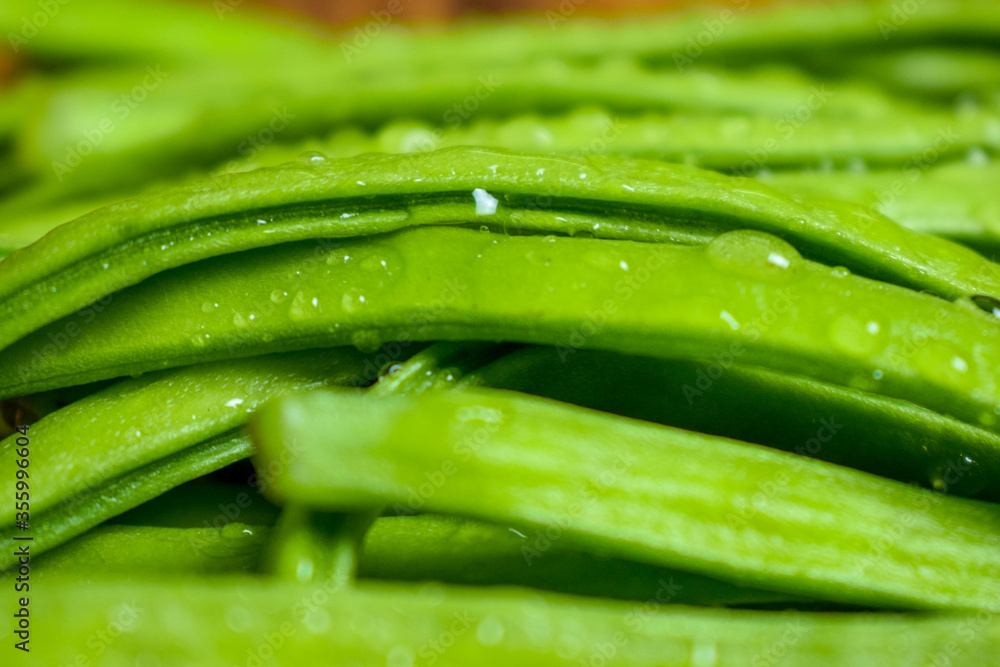 Cluster Bean or GuarAlso Known as Gavar, Guwar or Guvar Bean isolated on Wooden Background Cluster Bean or GuarAlso Known as Gavar, Guwar or Guvar Bean isolated on Wooden Background