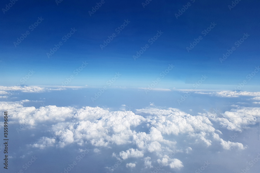 Beautiful high sky, above view of abstract circles pattern white clouds at the blue sky 