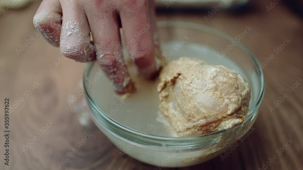 Putting marinated RAW ORGANIC CHICKEN DRUMSTICK into flour the in water the again in flour. From marinating bowl into flour. Concept of preparing Fried Chicken into a lot of boiling oil step by step. Putting marinated RAW ORGANIC CHICKEN DRUMSTICK into flour the in water the again in flour. From marinating bowl into flour. Concept of preparing Fried Chicken into a lot of boiling oil step by step.