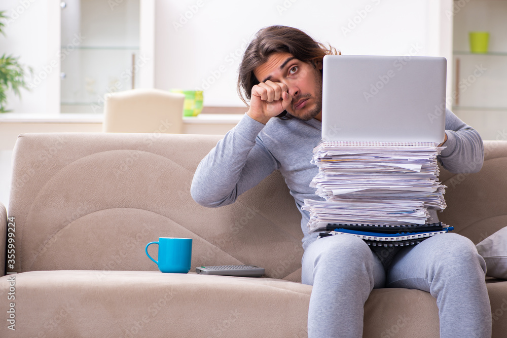 Young male employee freelancer working from home Young male employee freelancer working from home