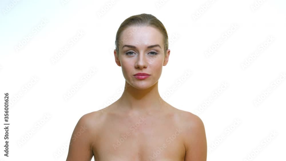 Portrait of a beautiful slim model with an organic bamboo toothbrush with black toothpaste in her hand smiling to camera Portrait of a beautiful slim model with an organic bamboo toothbrush with black toothpaste in her hand smiling to camera
