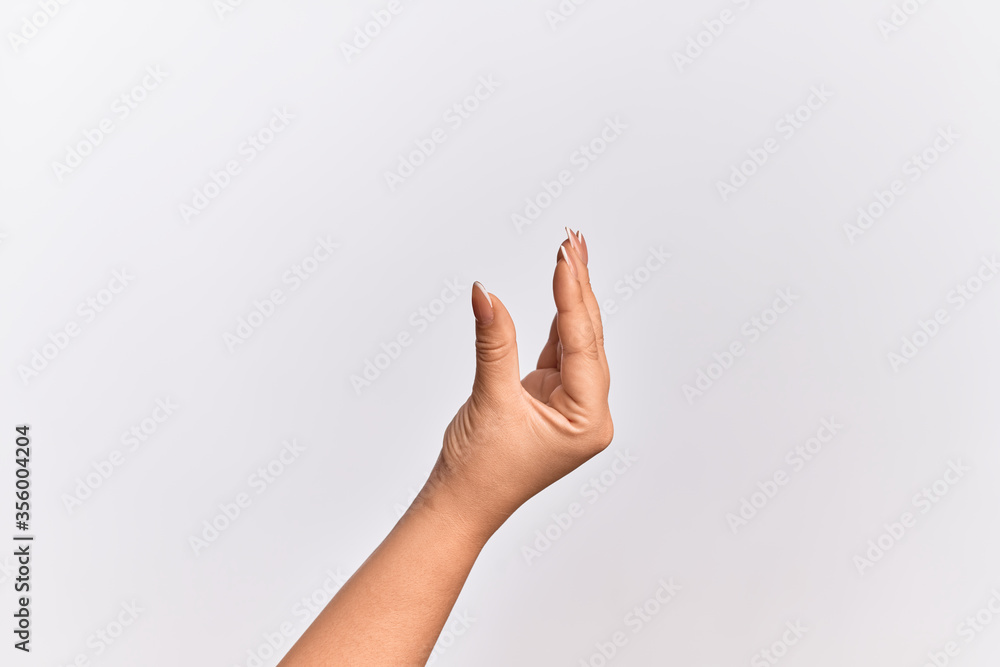 Hand of caucasian young woman picking and taking invisible thing, holding object with fingers showing space Hand of caucasian young woman picking and taking invisible thing, holding object with fingers showing space