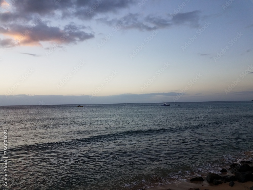 water and boats and sand and rocks in Aguadilla, Puerto Rico
