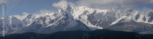 Snow-covered mountain range, panorama nature, Altai. Traveling in the mountains, climbing.  © Valerii