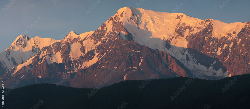 The ridge at dawn, panorama landscape. Traveling in the mountains, climbing. 