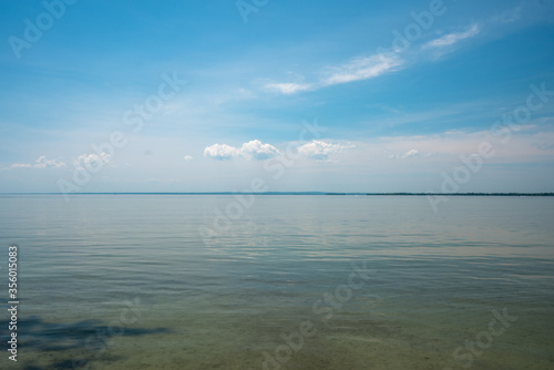 Beautiful Waterfront Landscape during Calm Summer Weather with Blue Sky © Ernest