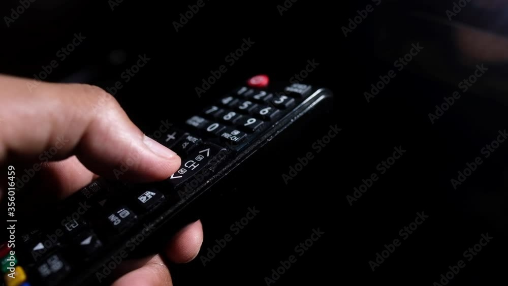 close up of man hand holding tv remote. close up of man hand holding tv remote.