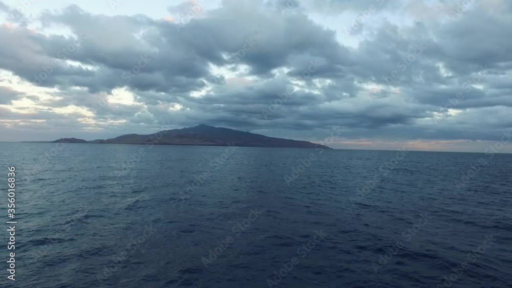 Dramatic arrival to a mysterious island with beautiful sky, Drone shot in 4K Dramatic arrival to a mysterious island with beautiful sky, Drone shot in 4K