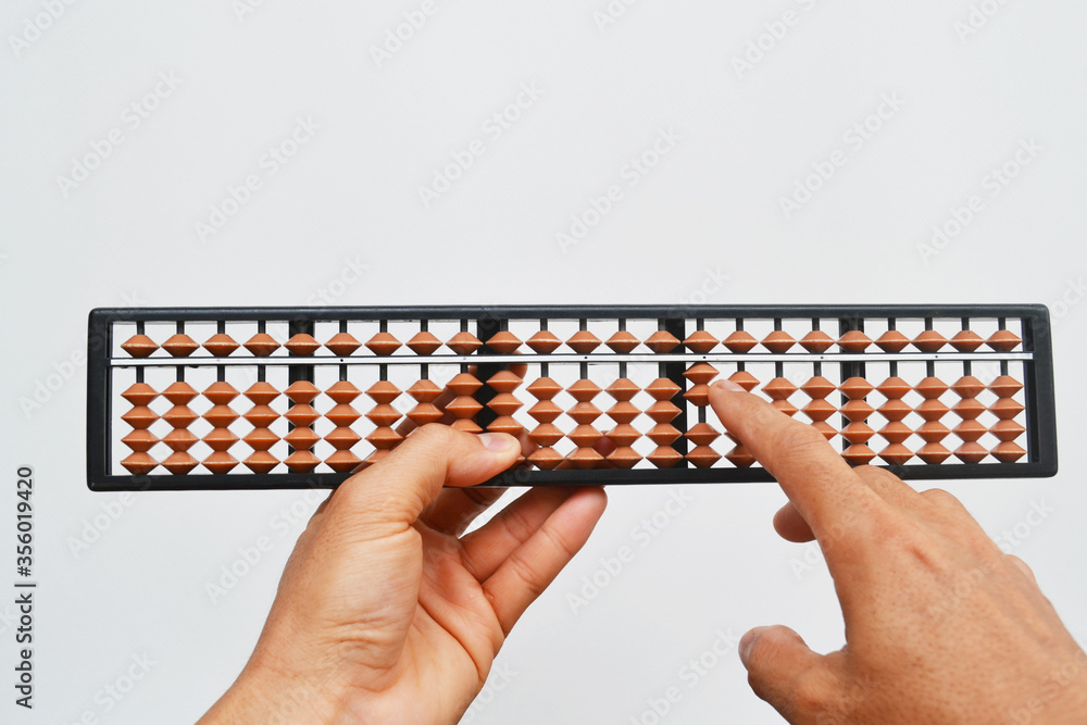 Hands with an abacus on a white background. Hands with an abacus on a white background.