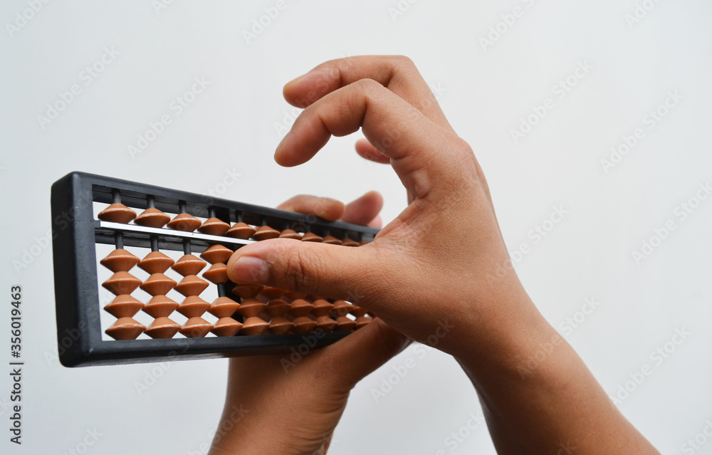 Hands with an abacus on a white background. Hands with an abacus on a white background.