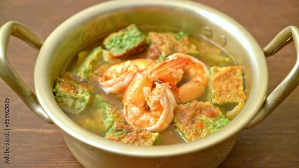 Sour soup made of Tamarind Paste with Shrimps and Vegetable Omelet - Asian food style Sour soup made of Tamarind Paste with Shrimps and Vegetable Omelet - Asian food style