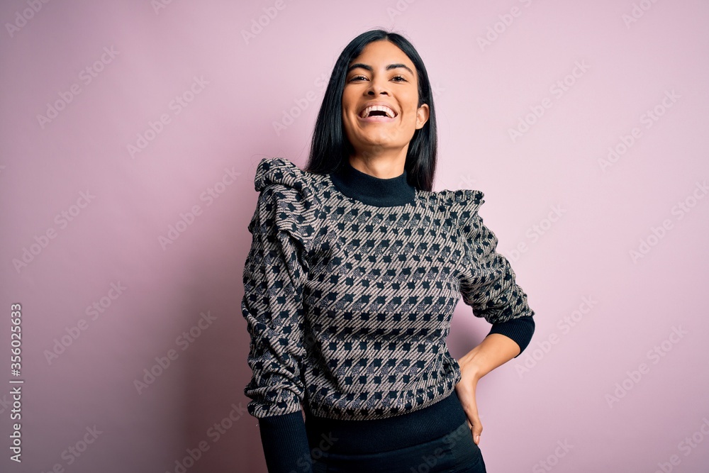 Young beautiful woman wearing fashion urban clothes, model wearing casual street style standing over pink background Young beautiful woman wearing fashion urban clothes, model wearing casual street style standing over pink background