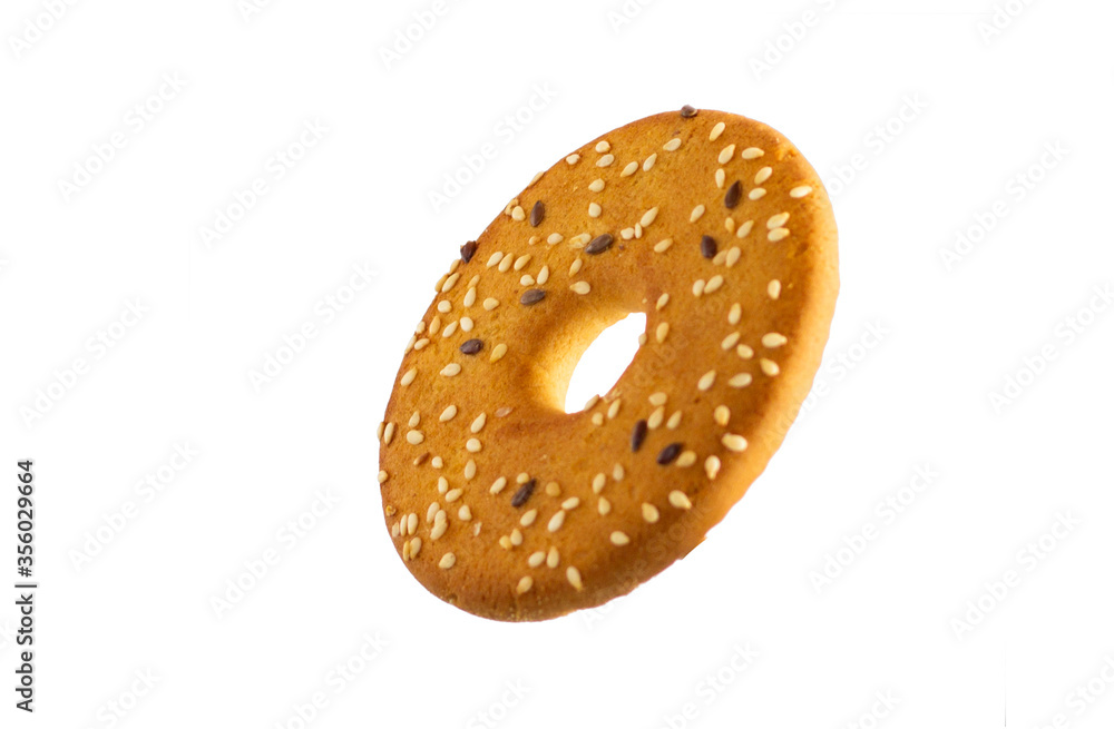 Round cookies with sesame seeds on a white background Round cookies with sesame seeds on a white background