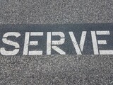 the word serve on the ground in white letters
