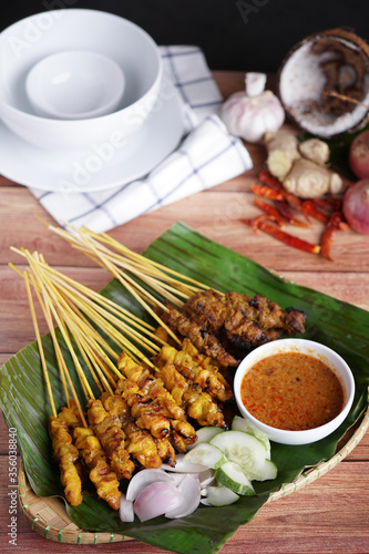 Satay is a popular Malaysia / Indonesia dish of seasoned, skewered and grilled chicken and meat, served with peanut sauce.
