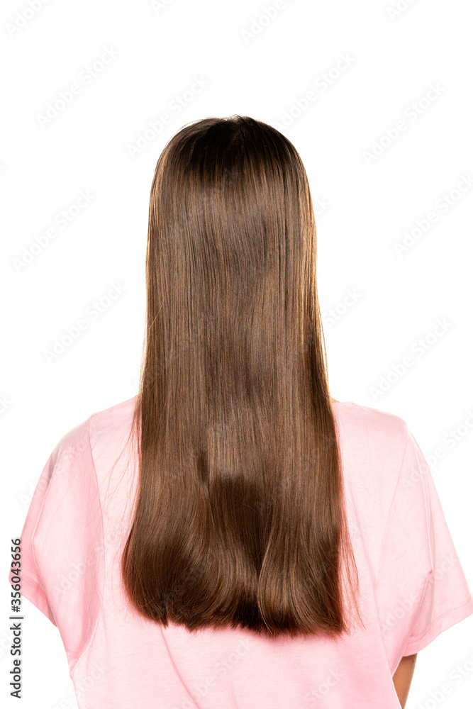 rear view of young woman with long hair rear view of young woman with long hair