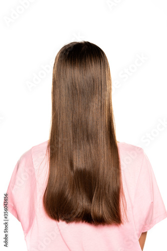 rear view of young woman with long hair