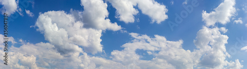 Wide panorama of the sky with cumulus clouds