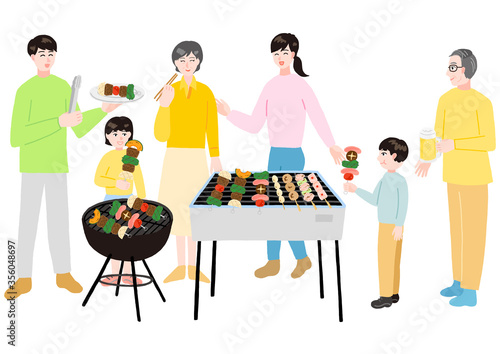 バーベキューをする三世代の家族