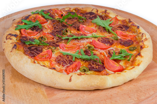 Pizza with thick outer ring on serving board close-up