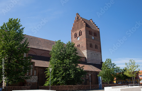 Old red church in køge with blue sky
