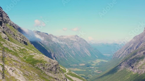 Aerial view of World famous mountain road Trollstigen and the Trollstigen bridge. Aerial view of lakes and torrents from the mountains and hills, mountaintops on Trollstigen road in Norway.