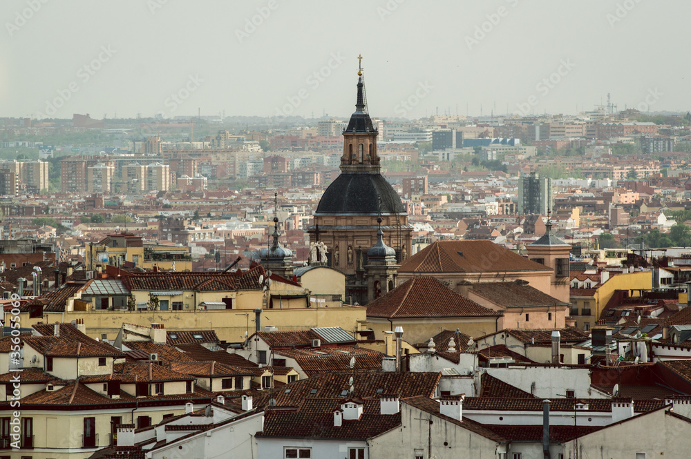 Madrid skyline rooftop view with buildings and church bell tower in Spain