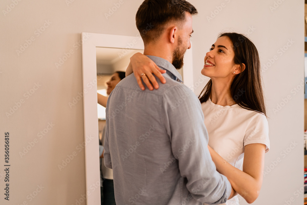 Portrait lovely couple hugging each other, smiling, enjoying time together Portrait lovely couple hugging each other, smiling, enjoying time together